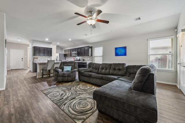 6011 Diantha St, Katy, TX 77449 - living room featuring a ceiling fan, wood finished floors, and baseboards