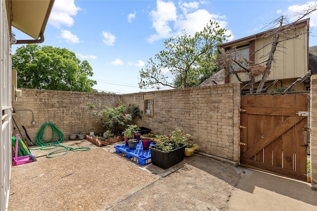 view of patio / terrace featuring fence private yard and a gate