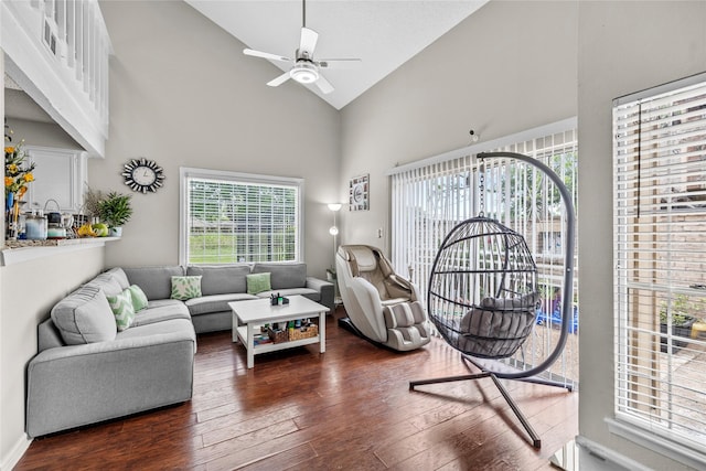 living area featuring high vaulted ceiling, ceiling fan, and hardwood / wood-style flooring
