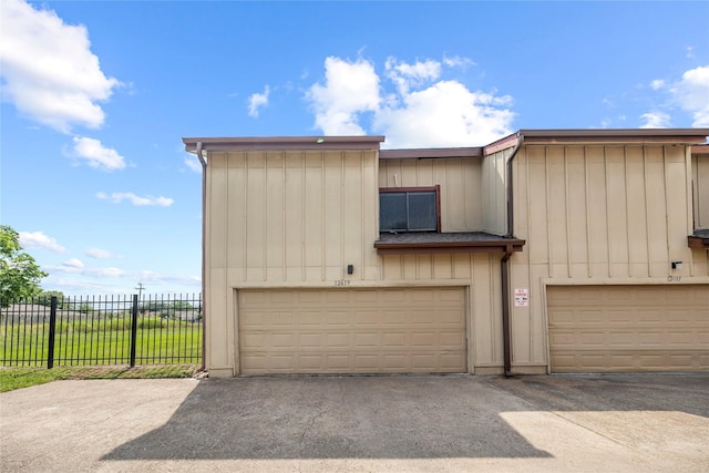 garage with fence