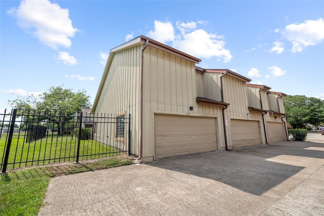exterior space featuring fence and driveway