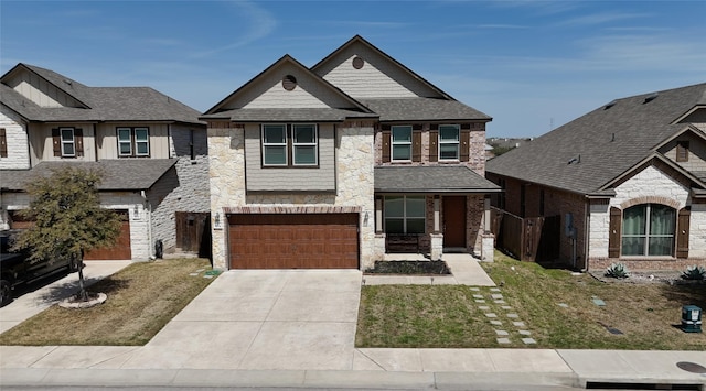 view of front of home with an attached garage, driveway, a front lawn, and stone siding