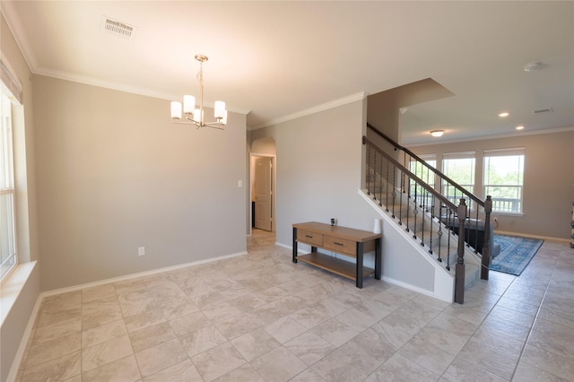 spare room with visible vents, ornamental molding, stairs, arched walkways, and a notable chandelier