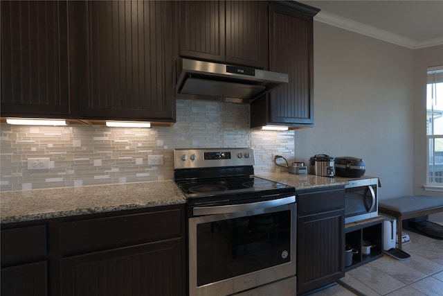 kitchen with under cabinet range hood, backsplash, crown molding, and appliances with stainless steel finishes