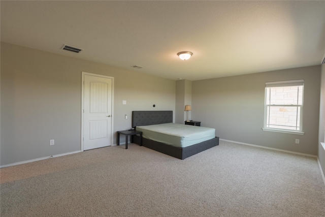 bedroom featuring carpet flooring, baseboards, and visible vents