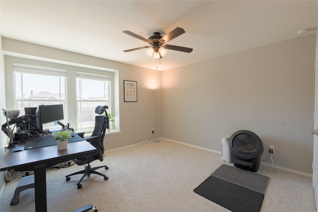office area featuring baseboards, a ceiling fan, and carpet flooring