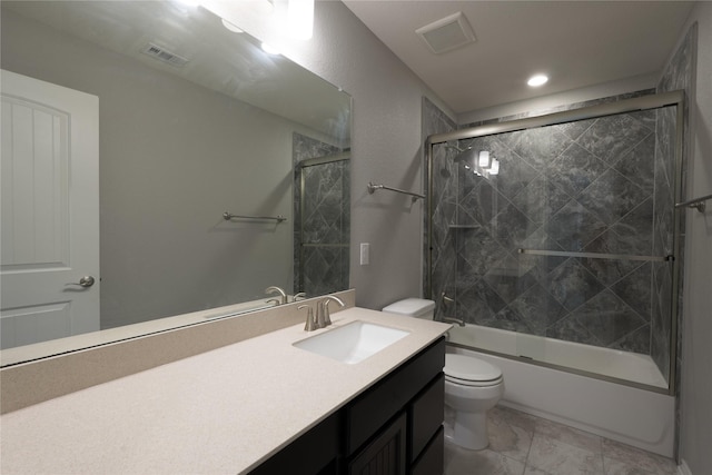 bathroom featuring vanity, enclosed tub / shower combo, toilet, and visible vents