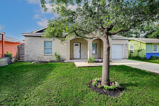 7315 Palestine St, Houston, TX 77020 - view of front of property featuring an attached garage, concrete driveway, and brick siding