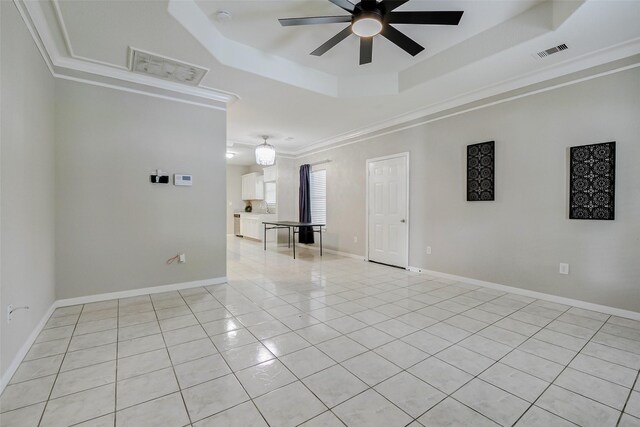 7315 Palestine St, Houston, TX 77020 - spare room with a raised ceiling, ceiling fan, crown molding, light tile patterned floors, and a smoke detector
