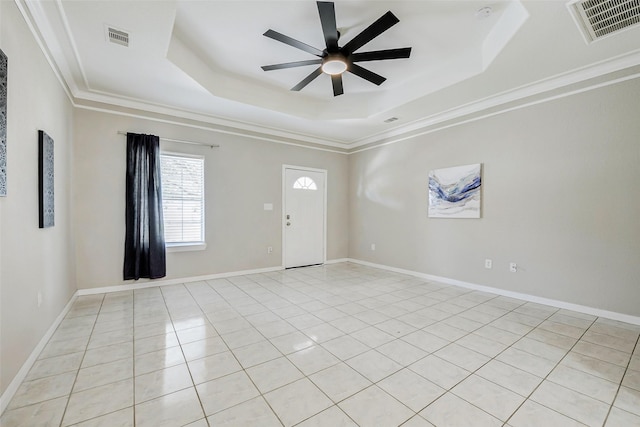 7315 Palestine St, Houston, TX 77020 - spare room with a tray ceiling, ceiling fan, light tile patterned floors, ornamental molding, and baseboards
