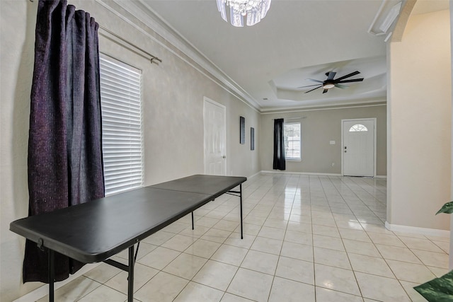 7315 Palestine St, Houston, TX 77020 - playroom with crown molding, light tile patterned floors, baseboards, a ceiling fan, and a tray ceiling