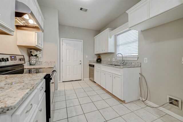 7315 Palestine St, Houston, TX 77020 - kitchen with stainless steel appliances, a sink, white cabinets, light tile patterned flooring, and wall chimney exhaust hood