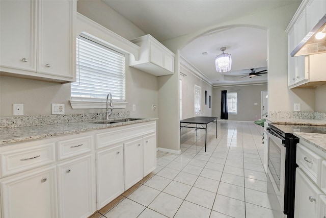 7315 Palestine St, Houston, TX 77020 - kitchen featuring a sink, stainless steel electric stove, wall chimney exhaust hood, crown molding, and light tile patterned flooring