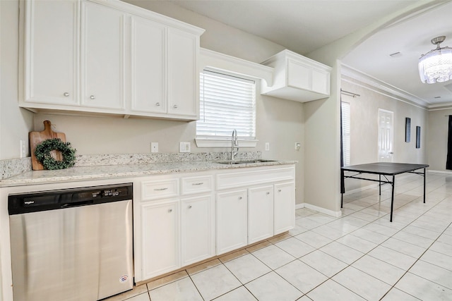 7315 Palestine St, Houston, TX 77020 - kitchen with stainless steel dishwasher, a sink, white cabinetry, light tile patterned floors, and crown molding