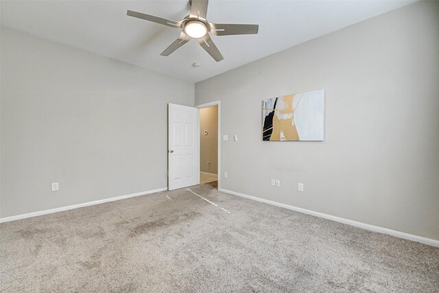 7315 Palestine St, Houston, TX 77020 - unfurnished bedroom featuring carpet flooring, baseboards, vaulted ceiling, and a ceiling fan