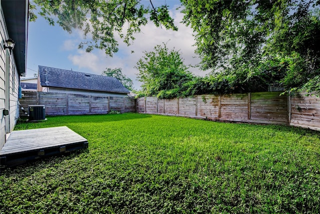 7315 Palestine St, Houston, TX 77020 - view of yard featuring central AC unit and a wooden deck