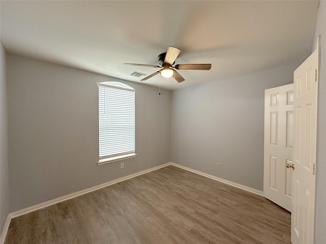 5310 Flagridge Ln, Houston, TX 77066 - spare room featuring wood finished floors, a ceiling fan, and baseboards