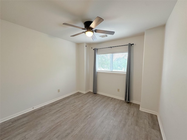 5310 Flagridge Ln, Houston, TX 77066 - spare room featuring wood finished floors, ceiling fan, and baseboards