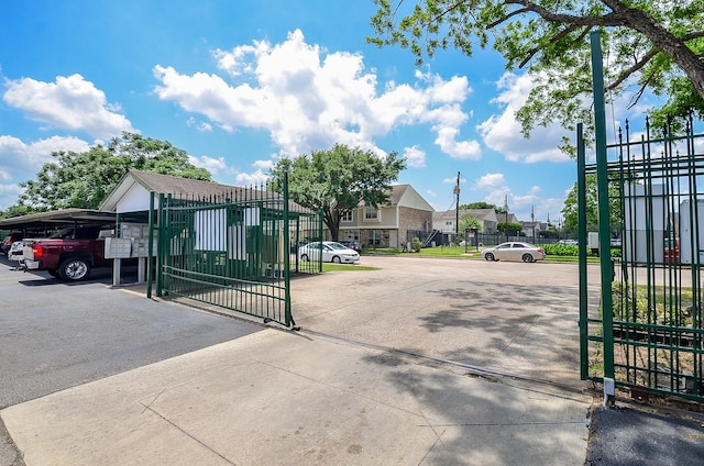 1950 Spenwick Dr Unit 302, Houston, TX 77055 - view of gate featuring fence and a residential view