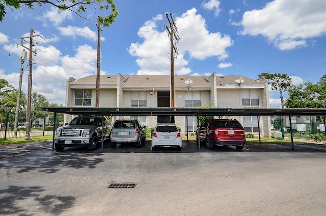 1950 Spenwick Dr Unit 302, Houston, TX 77055 - covered parking lot with fence