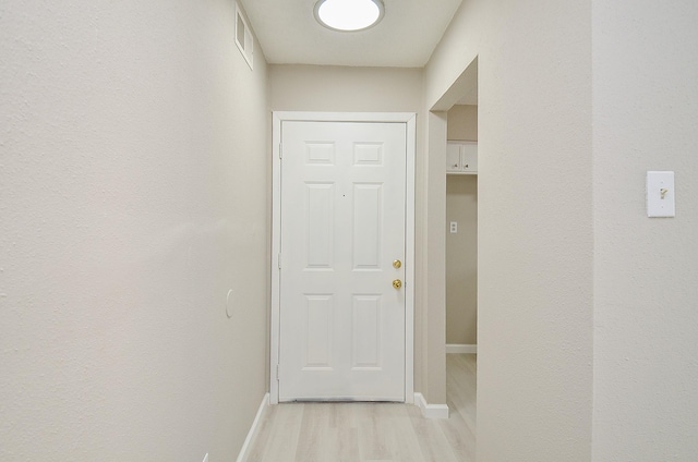 1950 Spenwick Dr Unit 302, Houston, TX 77055 - doorway to outside featuring baseboards, light wood-style flooring, and visible vents