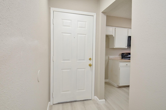 1950 Spenwick Dr Unit 302, Houston, TX 77055 - interior space featuring baseboards and light wood-style flooring