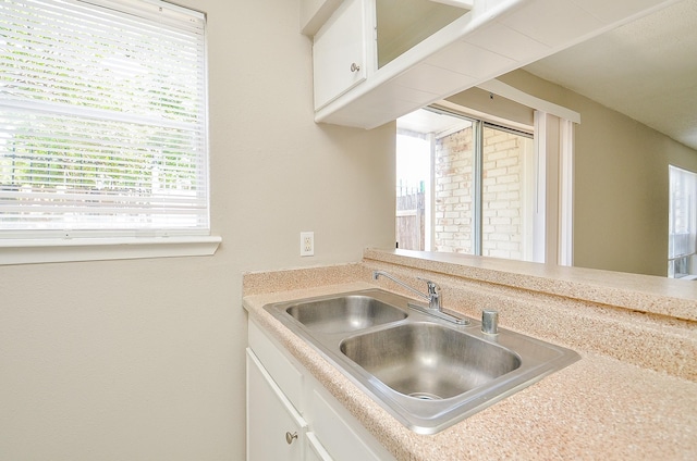 1950 Spenwick Dr Unit 302, Houston, TX 77055 - kitchen with a sink, white cabinetry, and light countertops