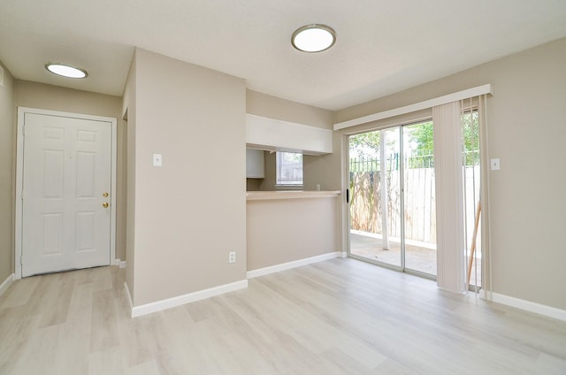 1950 Spenwick Dr Unit 302, Houston, TX 77055 - spare room featuring baseboards and wood finished floors