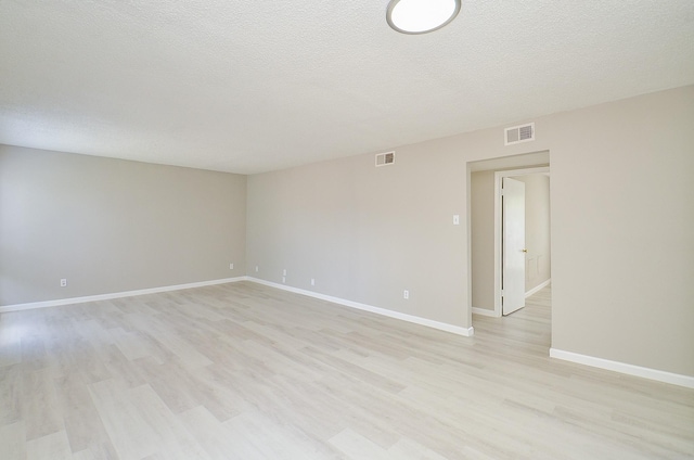 1950 Spenwick Dr Unit 302, Houston, TX 77055 - empty room featuring a textured ceiling, visible vents, baseboards, and light wood finished floors