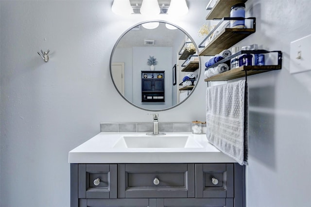 bathroom featuring vanity and visible vents