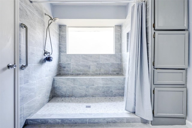 bathroom featuring a shower stall