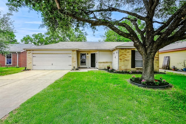 ranch-style home with brick siding, an attached garage, driveway, and a front lawn