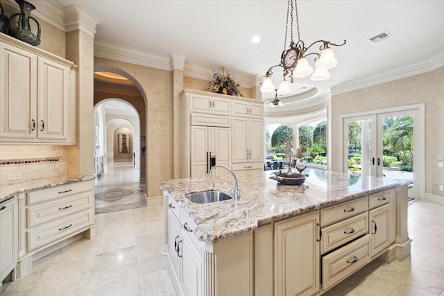 25 Kings Lake Estates Blvd, Humble, TX 77346 - kitchen with visible vents, ornamental molding, arched walkways, a chandelier, and a sink