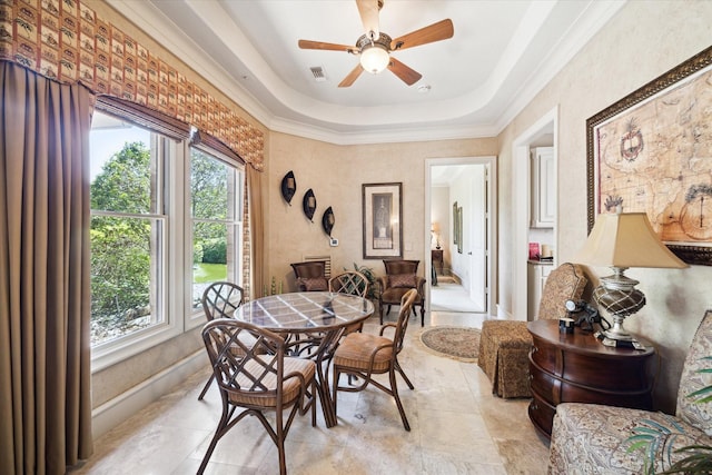 25 Kings Lake Estates Blvd, Humble, TX 77346 - dining room featuring a tray ceiling, plenty of natural light, ornamental molding, and a ceiling fan