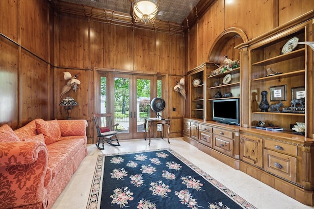 25 Kings Lake Estates Blvd, Humble, TX 77346 - living room featuring crown molding, an ornate ceiling, a high ceiling, and wood walls