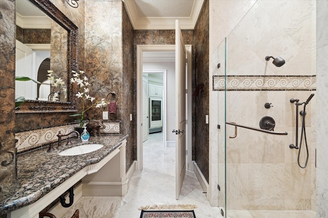 25 Kings Lake Estates Blvd, Humble, TX 77346 - bathroom featuring crown molding, a sink, marble finish floor, and a stall shower