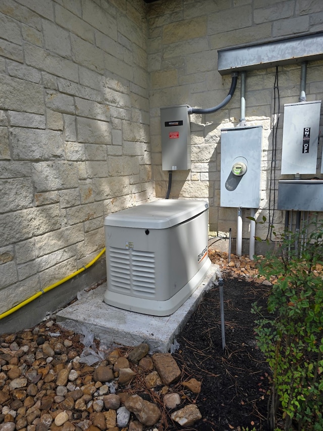 25 Kings Lake Estates Blvd, Humble, TX 77346 - exterior view of a power unit, stone siding, and electric meter