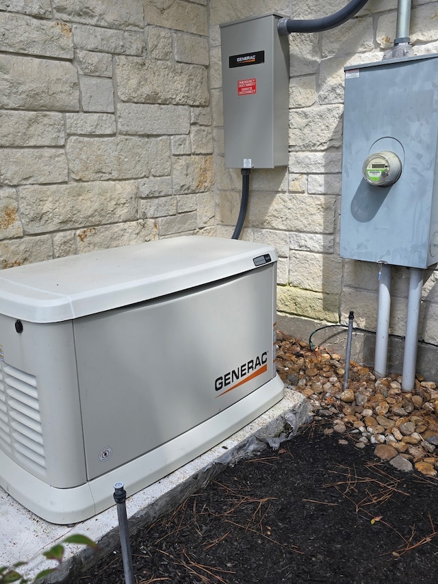 25 Kings Lake Estates Blvd, Humble, TX 77346 - exterior view of a power unit, stone siding, and electric meter