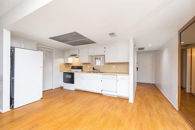 14777 Wunderlich Dr Unit 1103, Houston, TX 77069 - kitchen featuring a sink, white appliances, light countertops, light wood-style flooring, and under cabinet range hood