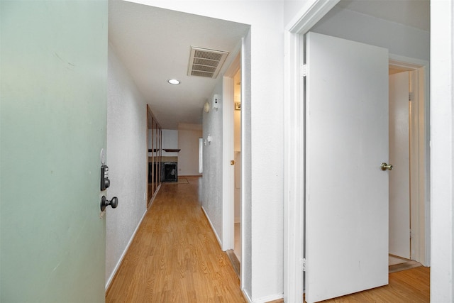 14777 Wunderlich Dr Unit 1103, Houston, TX 77069 - corridor with recessed lighting, visible vents, and light wood-type flooring