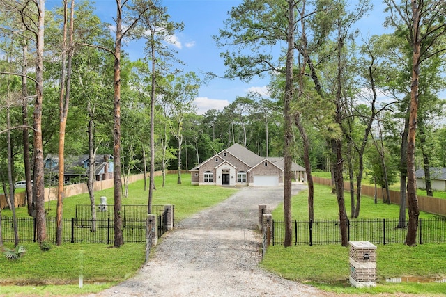58-D Hickory Ridge Dr, Huffman, TX 77336 - view of front of property featuring an attached garage, fence private yard, a front yard, and dirt driveway