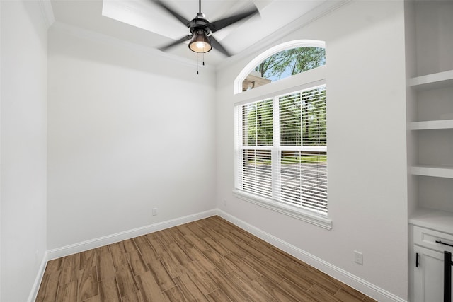 58-D Hickory Ridge Dr, Huffman, TX 77336 - unfurnished dining area with a ceiling fan, crown molding, built in shelves, wood finished floors, and baseboards