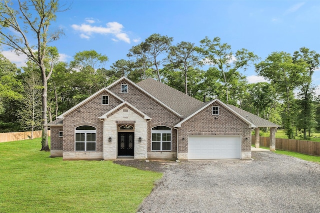 58-D Hickory Ridge Dr, Huffman, TX 77336 - view of front of property with fence, a front yard, gravel driveway, a shingled roof, and an attached garage