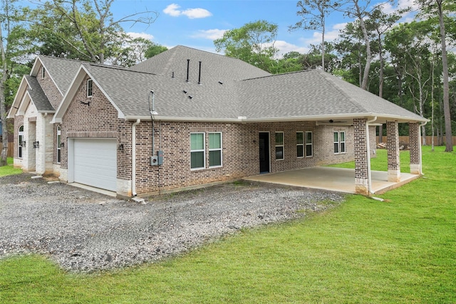 58-D Hickory Ridge Dr, Huffman, TX 77336 - rear view of house featuring a yard, brick siding, driveway, and a shingled roof