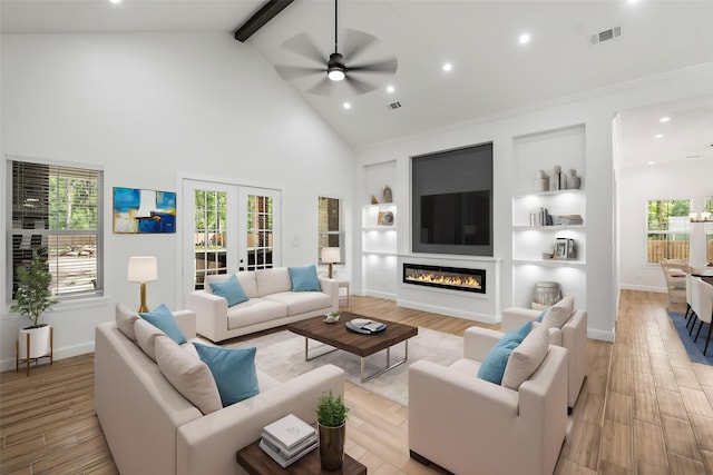 58-D Hickory Ridge Dr, Huffman, TX 77336 - living room with ceiling fan, visible vents, beam ceiling, and light wood-style floors