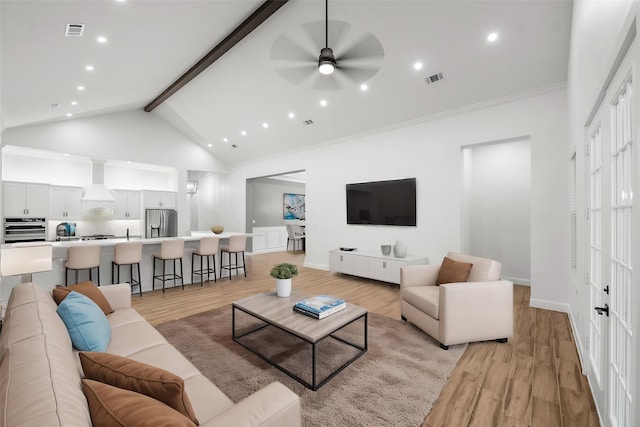 58-D Hickory Ridge Dr, Huffman, TX 77336 - living area featuring a ceiling fan, high vaulted ceiling, visible vents, and light wood-type flooring