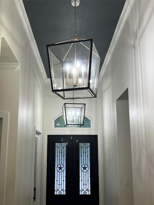 58-D Hickory Ridge Dr, Huffman, TX 77336 - foyer entrance featuring an inviting chandelier and ornamental molding