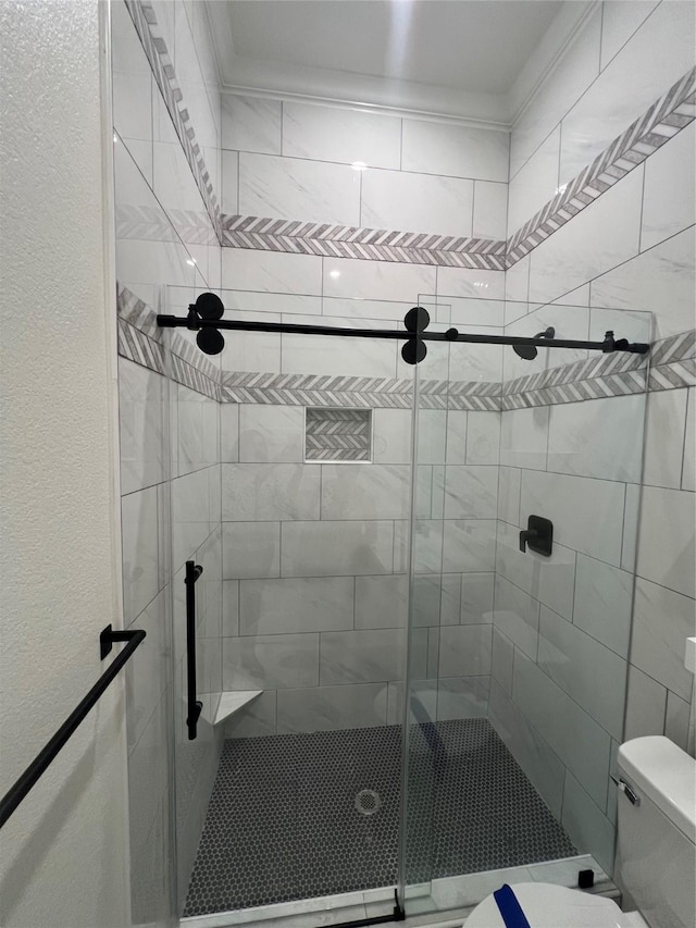 58-D Hickory Ridge Dr, Huffman, TX 77336 - full bathroom featuring a shower stall and toilet