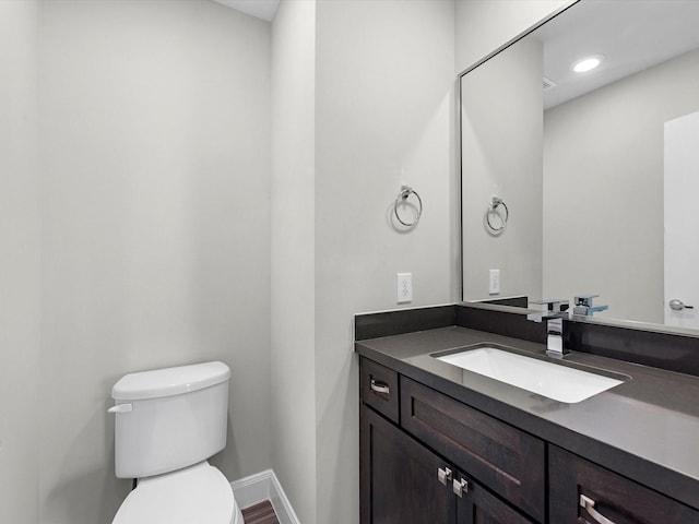 302 Eado Park Cir, Houston, TX 77020 - half bathroom with baseboards, toilet, and vanity
