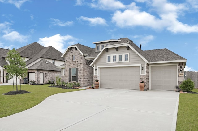view of front of home featuring a shingled roof, a front lawn, brick siding, a garage, and concrete driveway